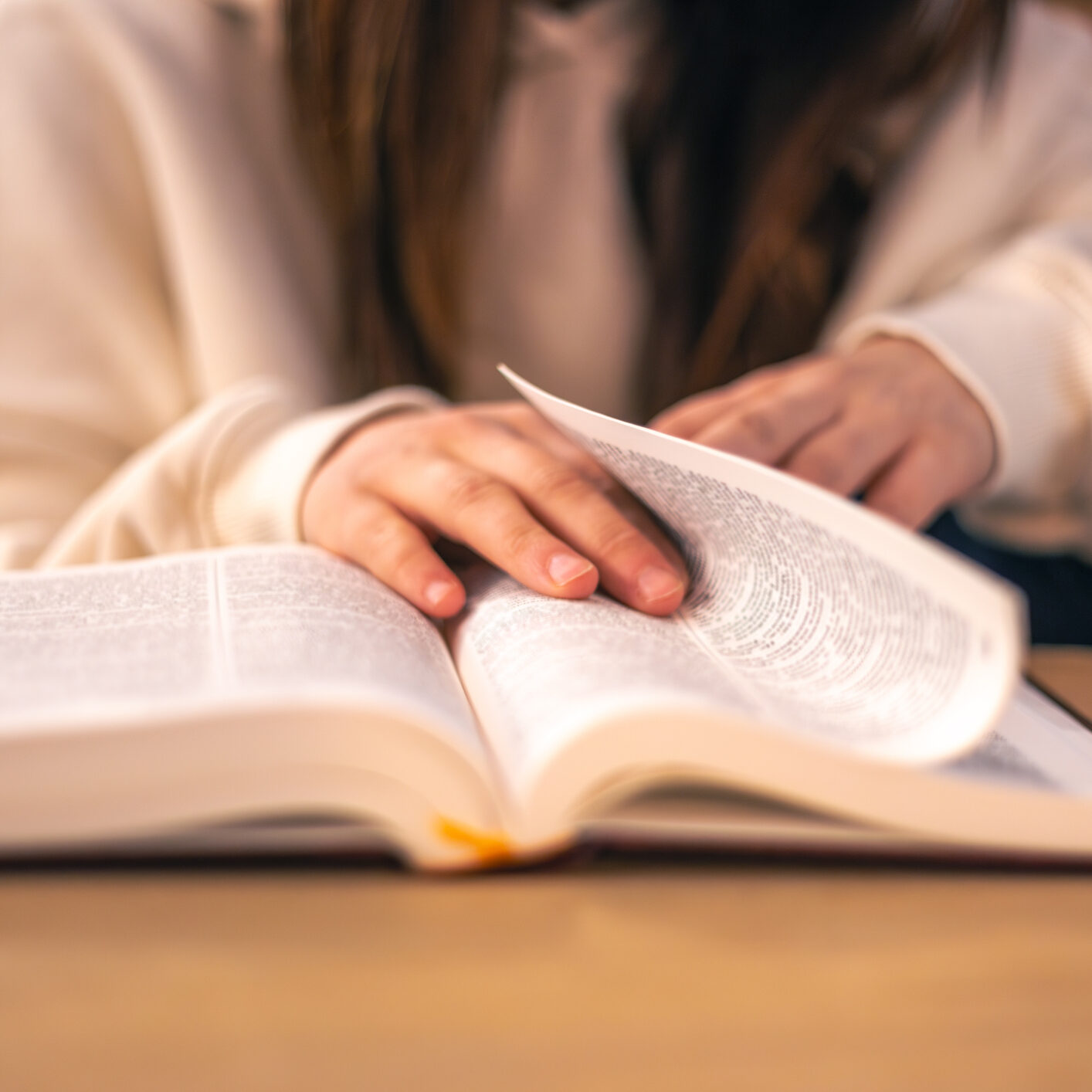 Bible close-up. Christianity concept. Reading the Holy Bible. High quality photo. Reading the Holy Bible, faith, worship, prayer. Bible in women's hands.